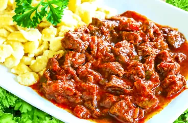 Authentic Hungarian Beef Goulash with Dumplings in 120 Minutes<span class="rmp-archive-results-widget "><i class=" rmp-icon rmp-icon--ratings rmp-icon--star rmp-icon--full-highlight"></i><i class=" rmp-icon rmp-icon--ratings rmp-icon--star rmp-icon--full-highlight"></i><i class=" rmp-icon rmp-icon--ratings rmp-icon--star rmp-icon--full-highlight"></i><i class=" rmp-icon rmp-icon--ratings rmp-icon--star rmp-icon--full-highlight"></i><i class=" rmp-icon rmp-icon--ratings rmp-icon--star rmp-icon--full-highlight"></i> <span>4.9 (7)</span></span>